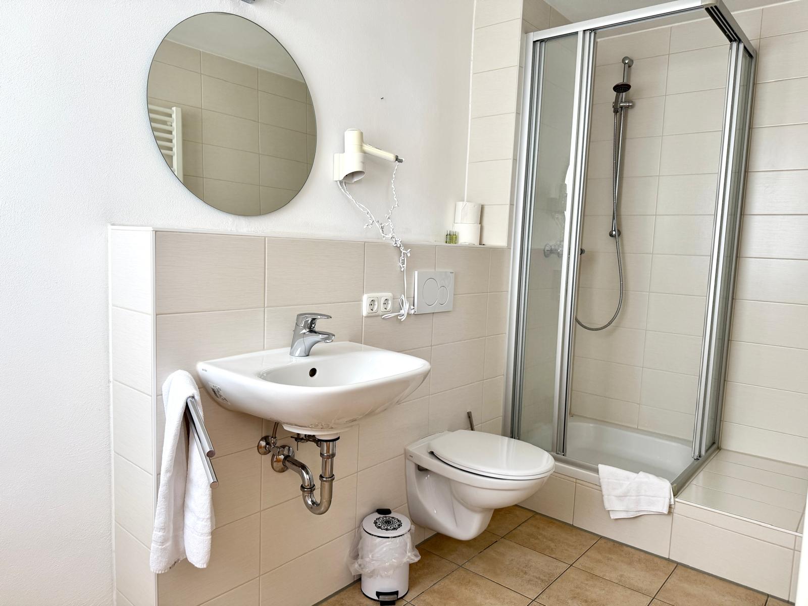 Spacious family suite bedroom with double bed at Hotel Stadtblick Friedberg