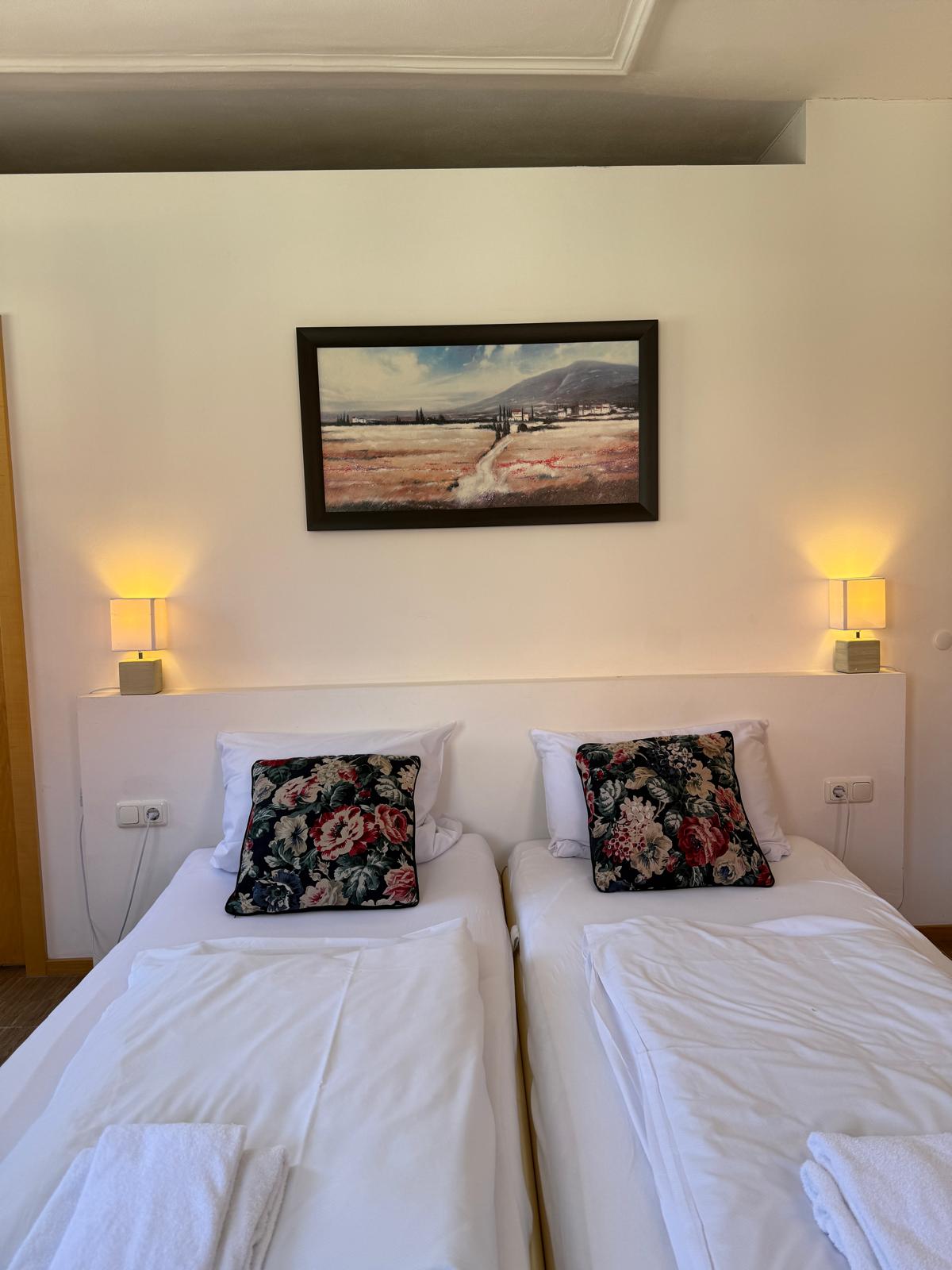 Spacious family suite bedroom with double bed at Hotel Stadtblick Friedberg