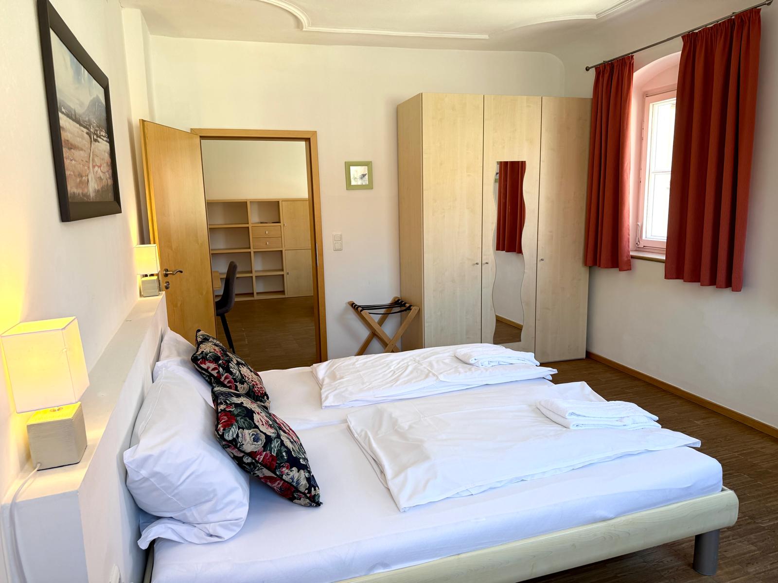 Spacious family suite bedroom with double bed at Hotel Stadtblick Friedberg