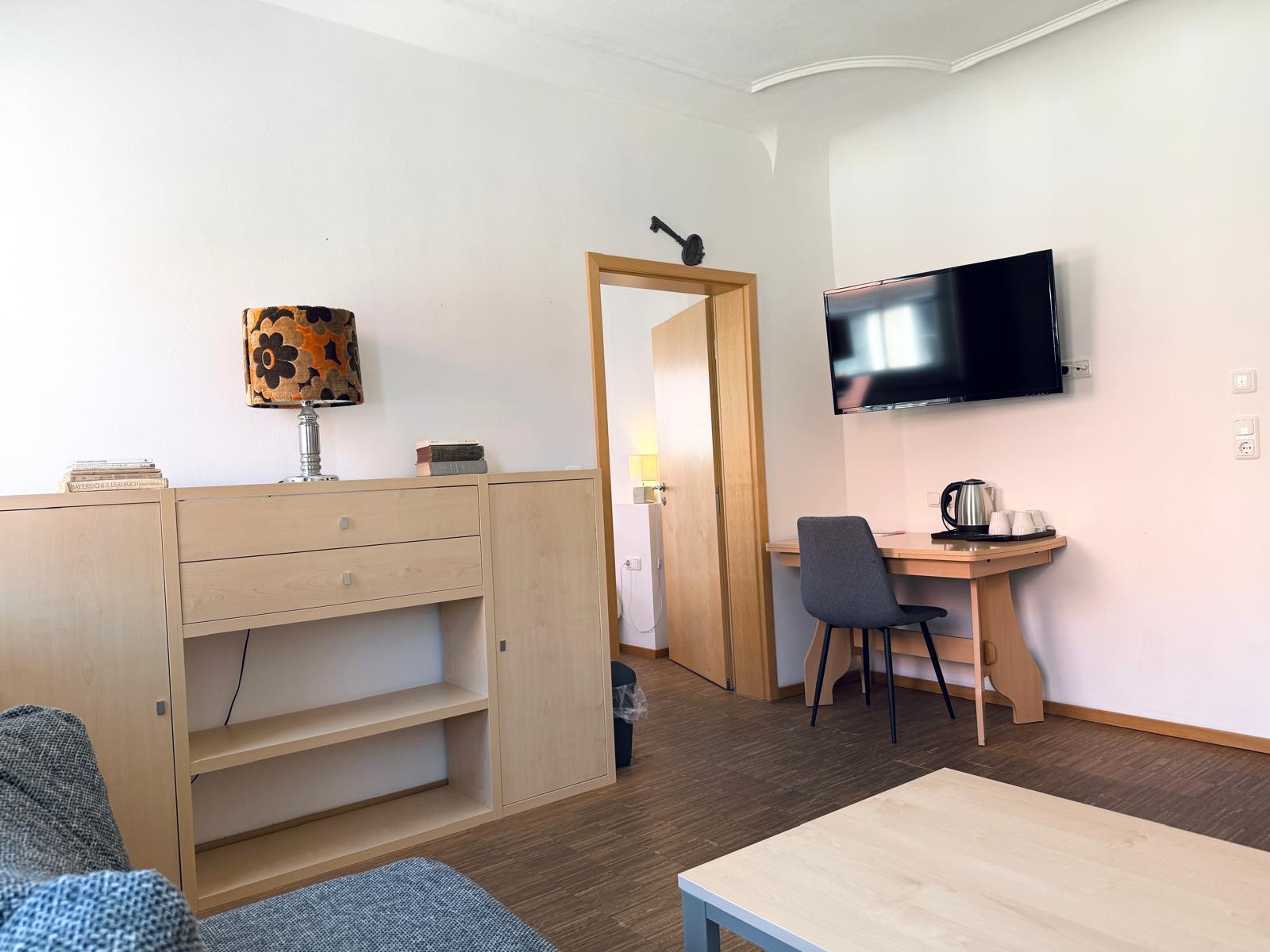 Spacious family suite bedroom with double bed at Hotel Stadtblick Friedberg